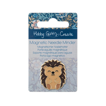 Round enamel magnetic needle minder with an enamel hedgehog design in warm brown and cream