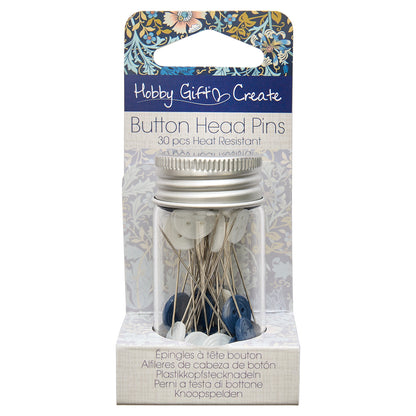 Glass jar of blue and white button head pins