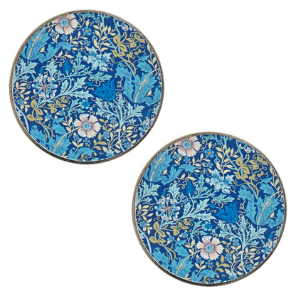 Two round metal pattern weights with woodblock print