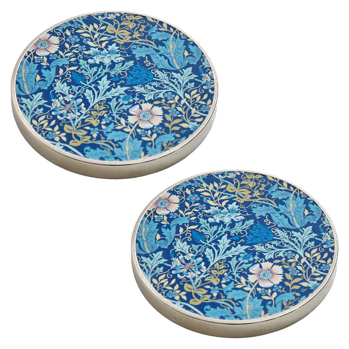 Two round metal pattern weights with woodblock print