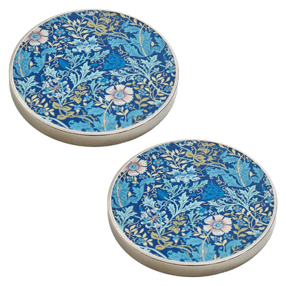 Two round metal pattern weights with woodblock print