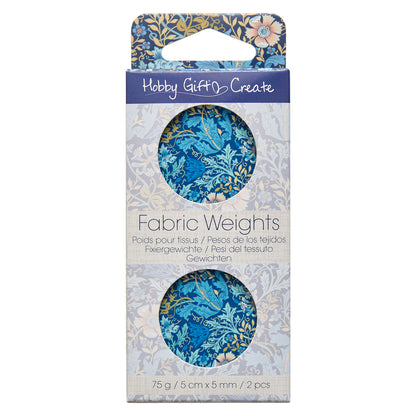 Two round metal pattern weights with woodblock print