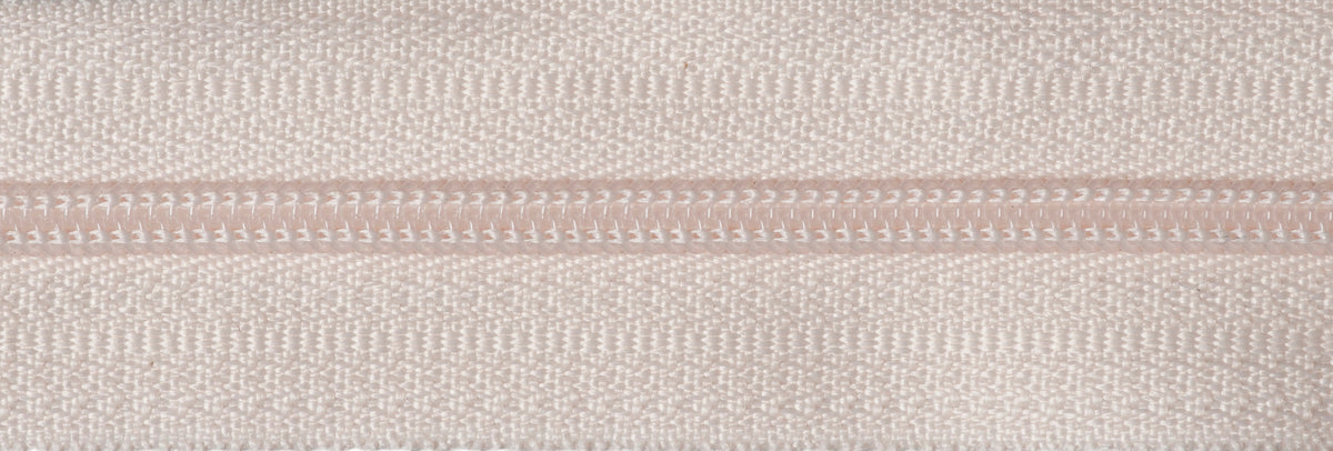 Roll of dark cream continuous nylon zip with sliders