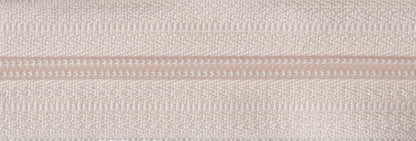 Roll of dark cream continuous nylon zip with sliders