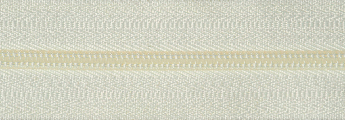 Roll of cream continuous nylon zip with sliders
