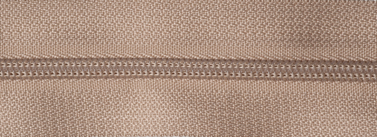 Roll of fawn continuous nylon zip with sliders