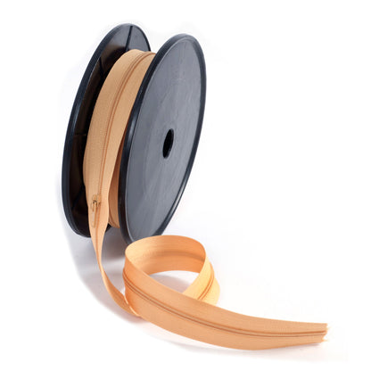 Roll of gold continuous nylon zip with sliders