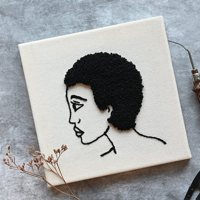 Two square wooden frames with pre-stretched punch needle fabric