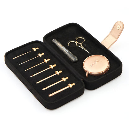 KnitPro Oasis starter crochet hook set with rose gold heads and grey onyx handle in a black faux suede case