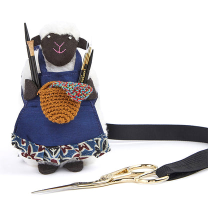 Sheep-shaped accessories holder with pocketed apron