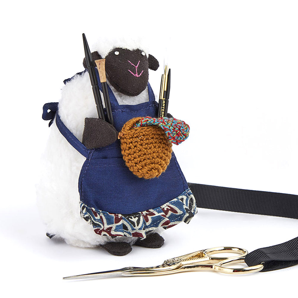 Sheep-shaped accessories holder with pocketed apron