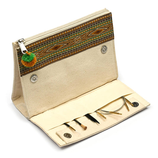 Ivory canvas zip case with woven band and pom pom