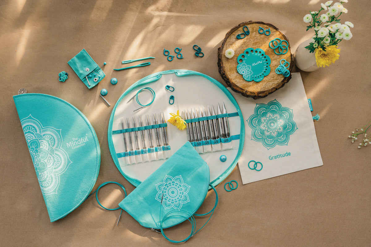 KnitPro Mindful Warmth interchangeable needle set in a semi-circular mandala fabric case
