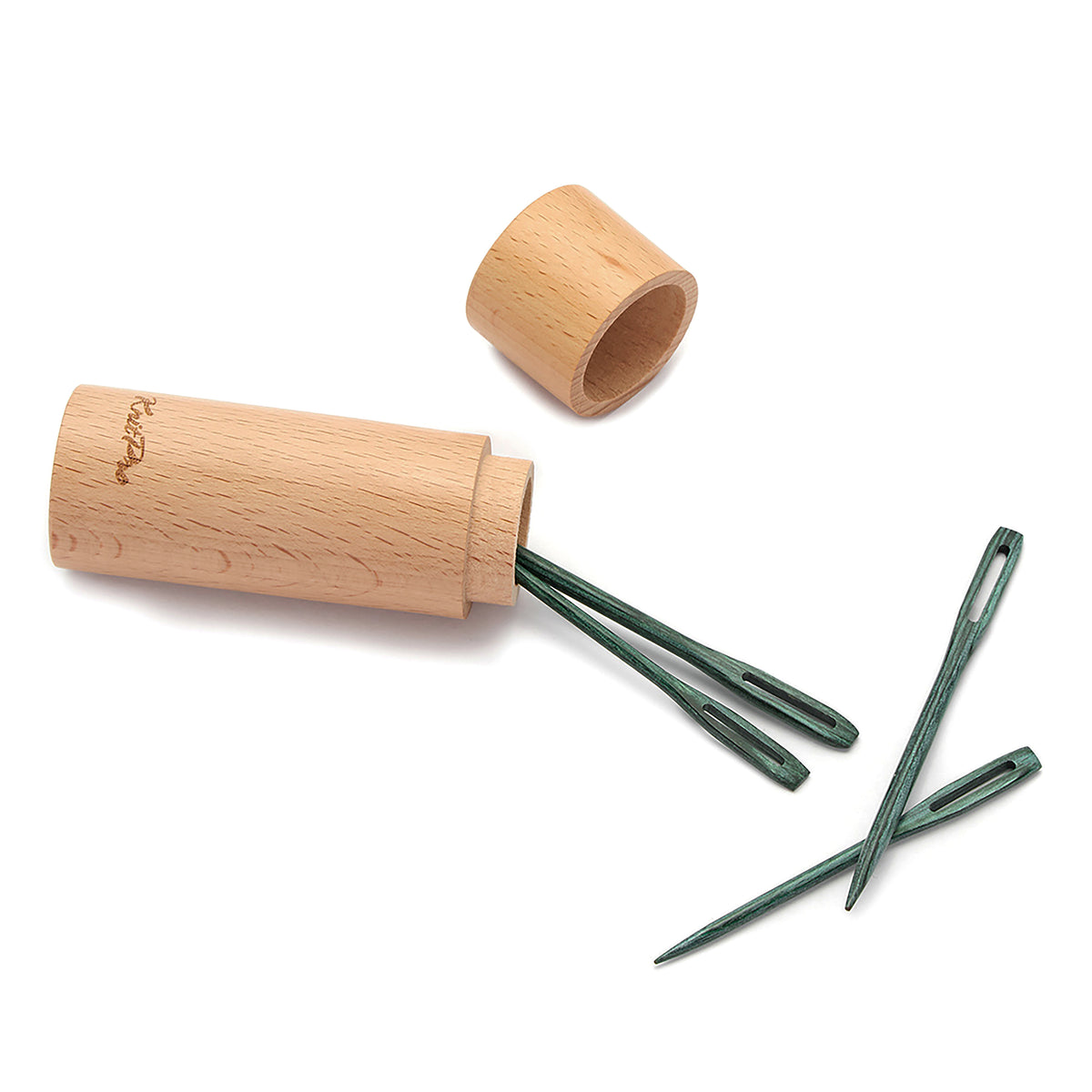 Four teal wooden darning needles beside a round wooden case