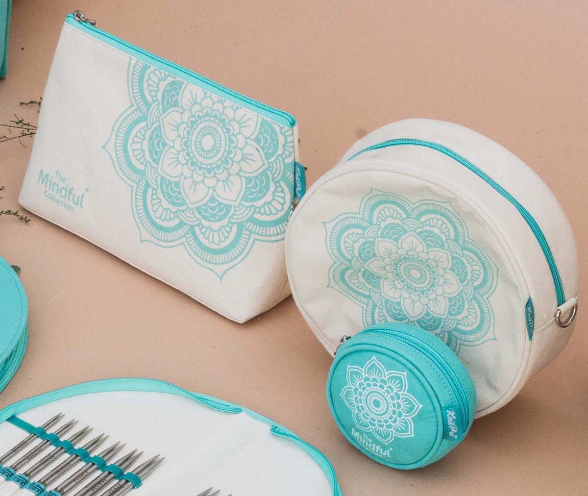 Two round KnitPro Mindful bags, large and small, with a strap