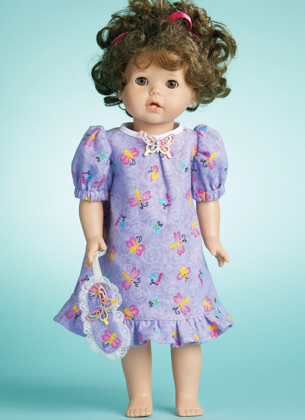 McCall's M6137 pattern envelope showing doll clothes