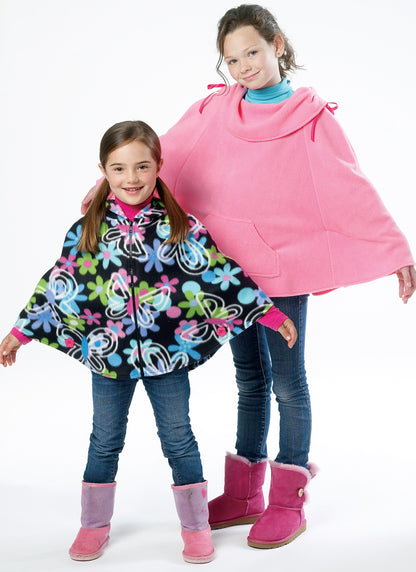 McCall's M6431 pattern envelope showing girls' ponchos