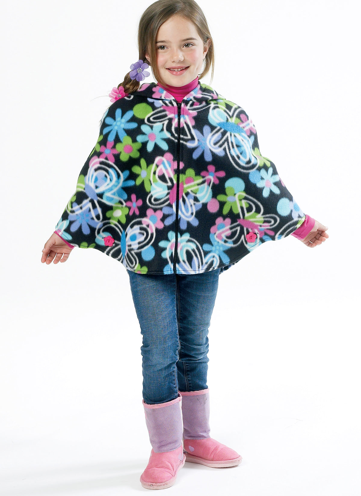 McCall's M6431 pattern envelope showing girls' ponchos