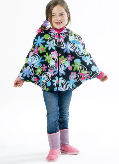 McCall's M6431 pattern envelope showing girls' ponchos