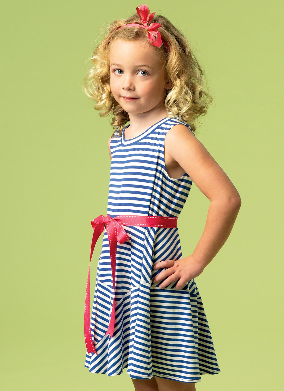 McCall's M6915 sewing pattern envelope showing girls' pullover dress