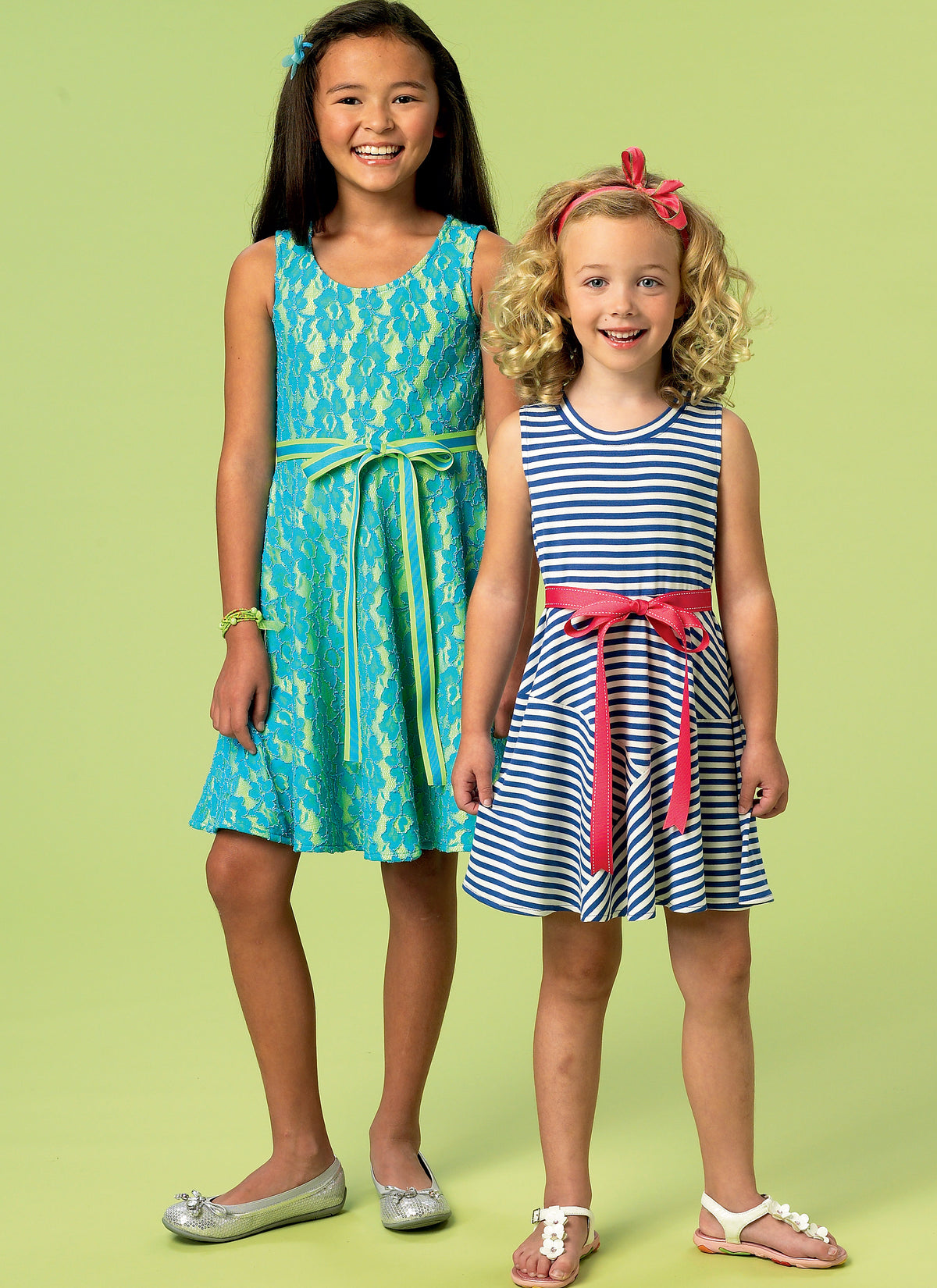 McCall's M6915 sewing pattern envelope showing girls' pullover dress