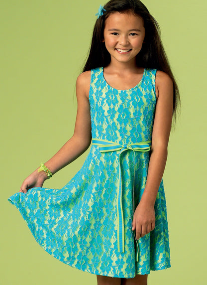 McCall's M6915 sewing pattern envelope showing girls' pullover dress