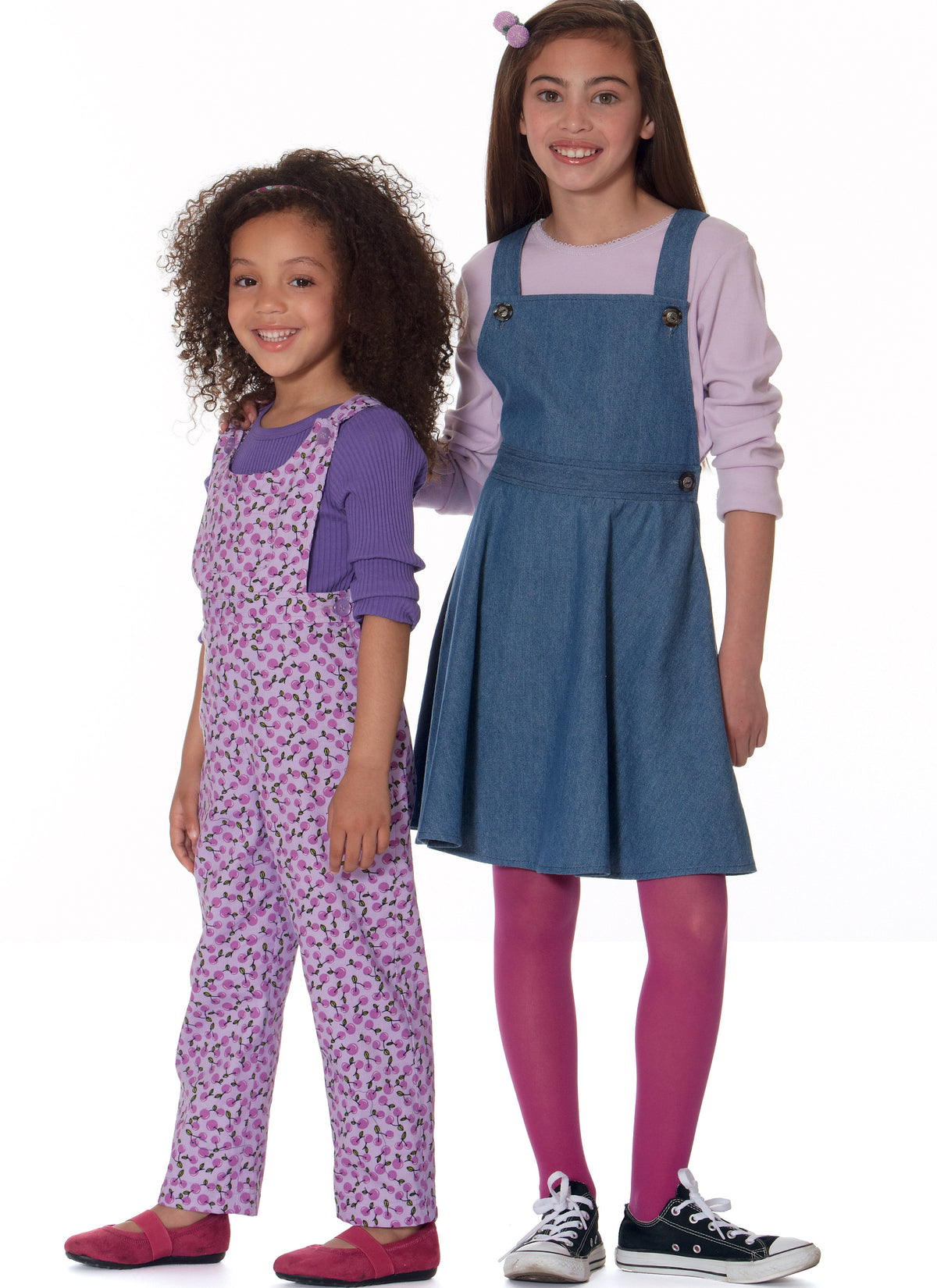 McCall's M7459 sewing pattern envelope showing pinafores and dungarees