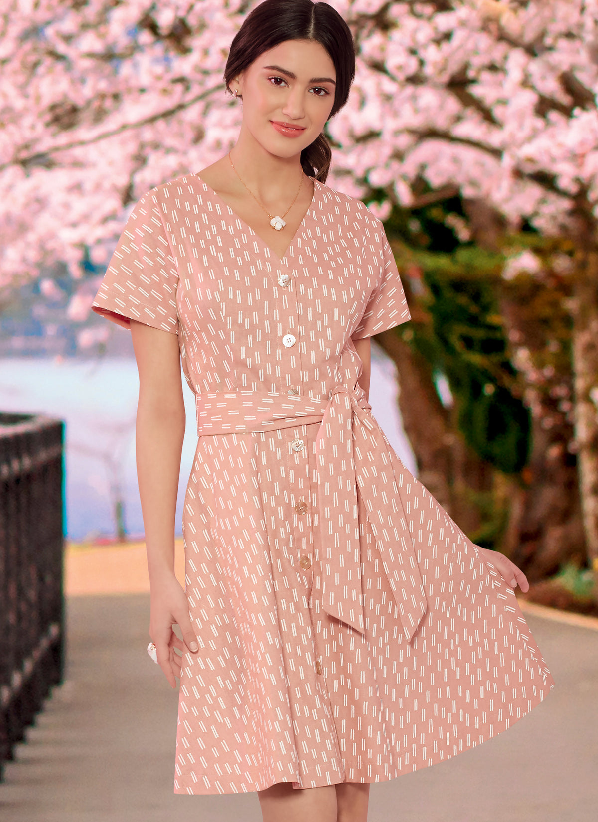 McCall's M7920 sewing pattern envelope showing button-front dress designs
