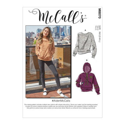 McCall's M8070 sewing pattern envelope showing unisex pullover top designs