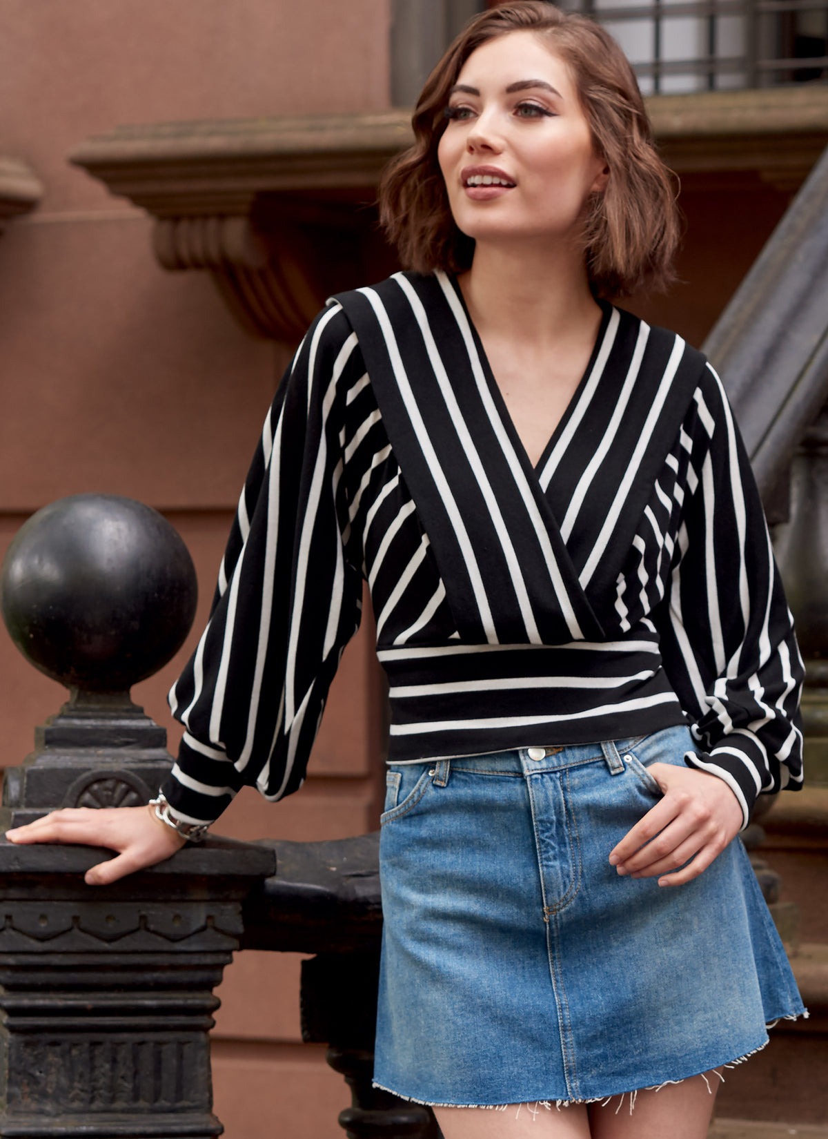McCall's M8145 sewing pattern envelope showing the surplice knit top designs