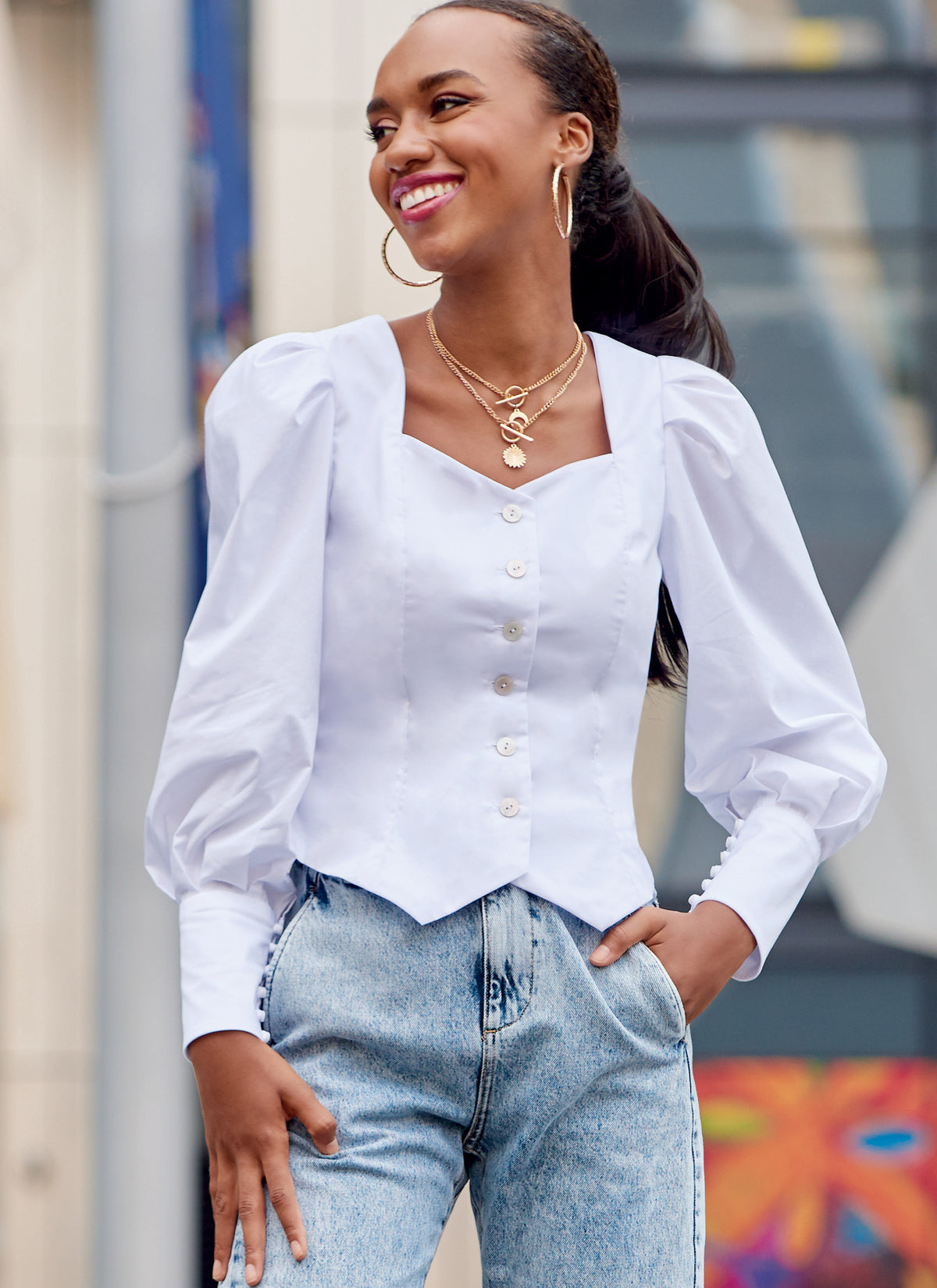 McCall's M8181 sewing pattern envelope showing a buttoned prairie-style peasant top with puff sleeves