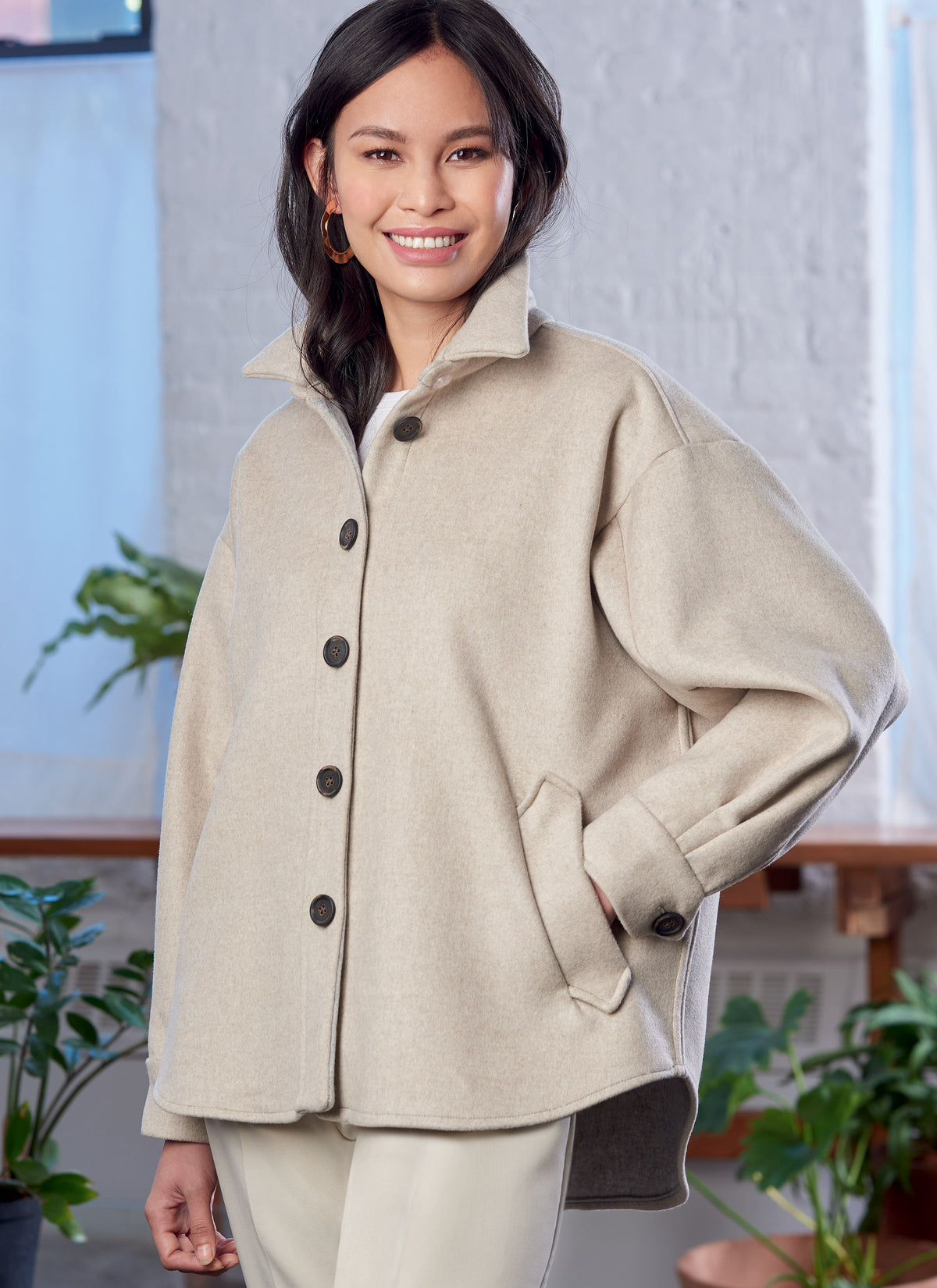 McCall's M8210 sewing pattern envelope showing a button-up shirt jacket (shacket)