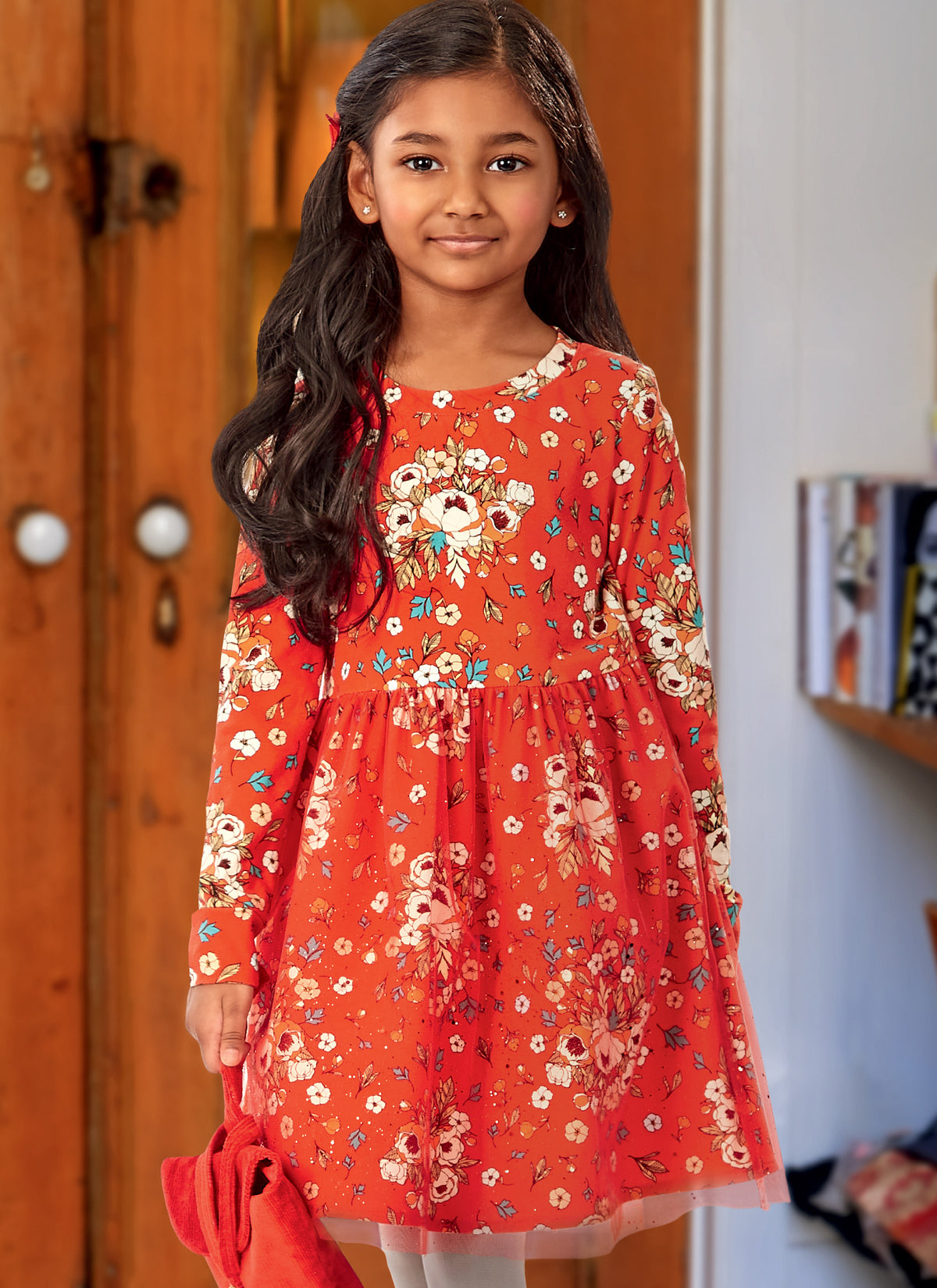 McCall's M8251 sewing pattern envelope showing girls' knit fit and flare dress designs