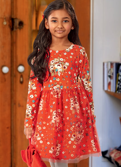 McCall's M8251 sewing pattern envelope showing girls' knit fit and flare dress designs