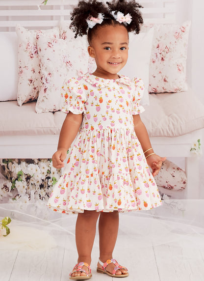 McCall's M8266 sewing pattern envelope showing fit-and-flare toddler dresses