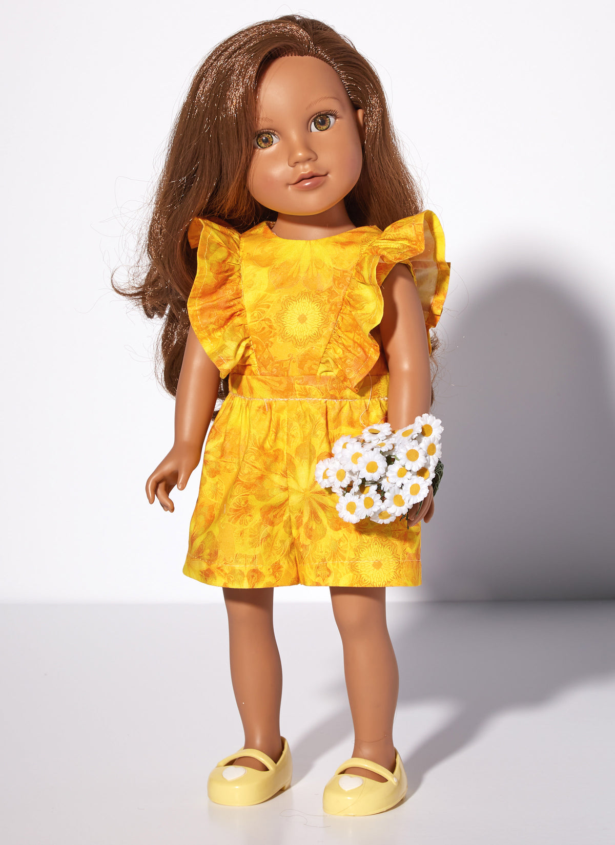 McCall's M8309 sewing pattern envelope showing spring and summer outfits for 18in dolls