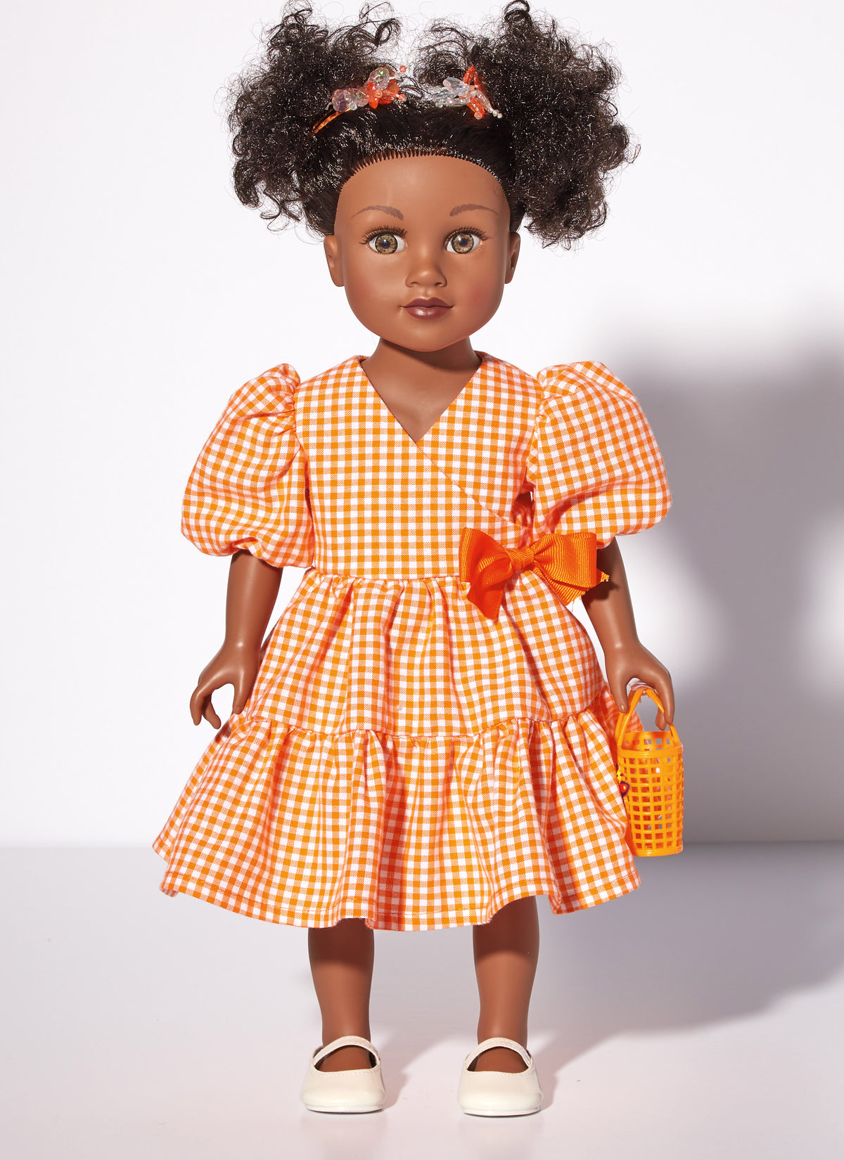McCall's M8309 sewing pattern envelope showing spring and summer outfits for 18in dolls