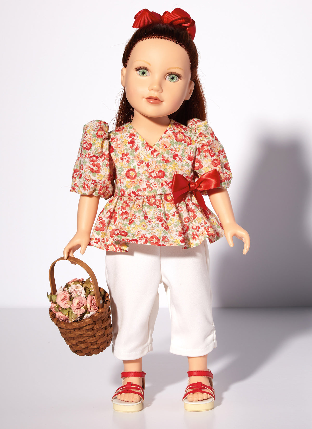 McCall's M8309 sewing pattern envelope showing spring and summer outfits for 18in dolls