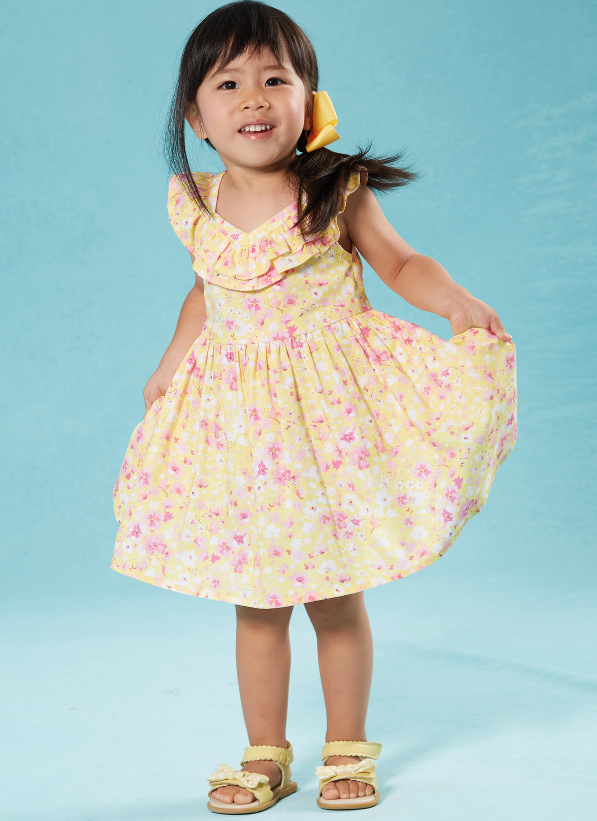 McCall's M8372 sewing pattern envelope showing knee-length toddler dresses