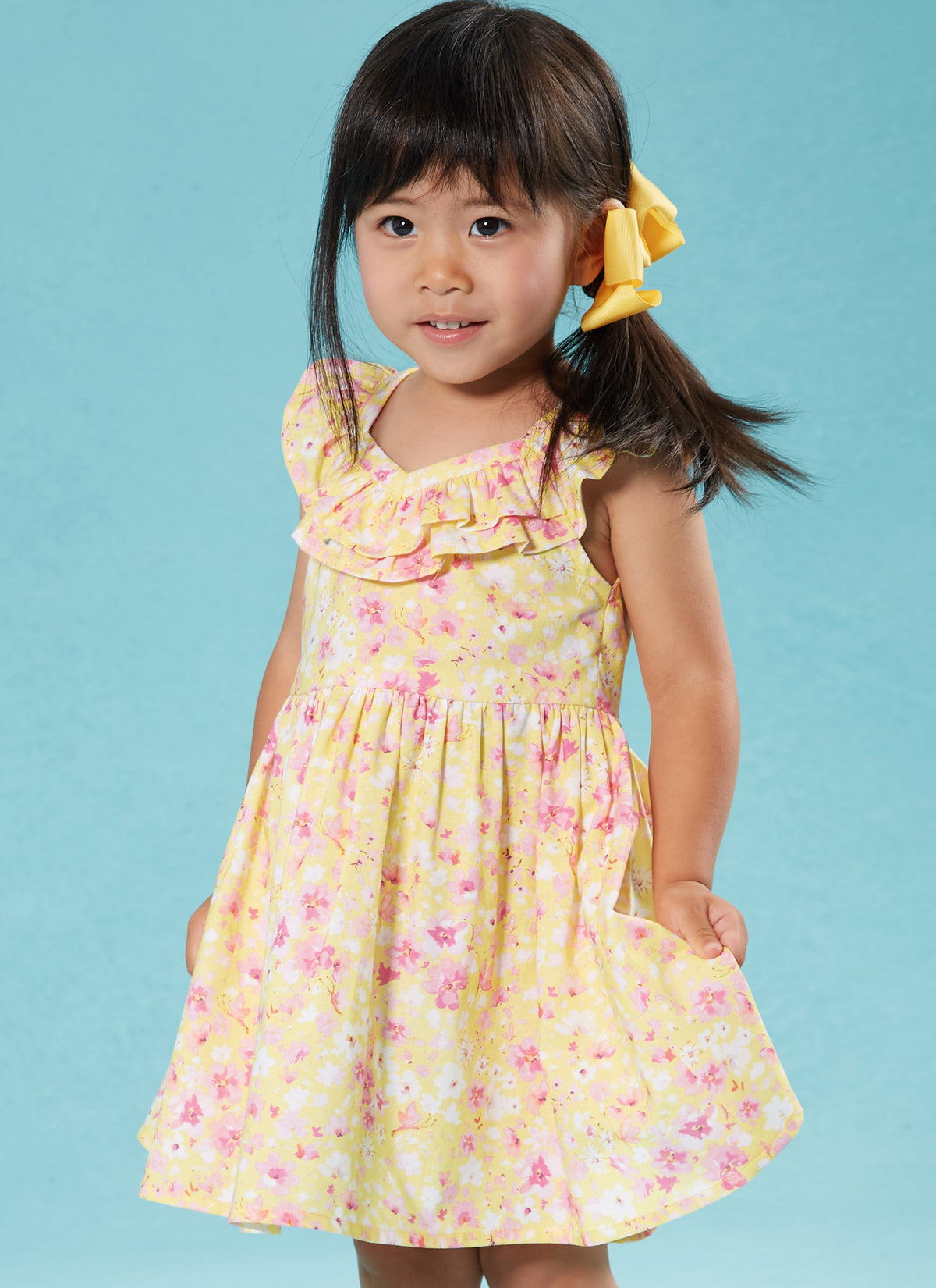 McCall's M8372 sewing pattern envelope showing knee-length toddler dresses