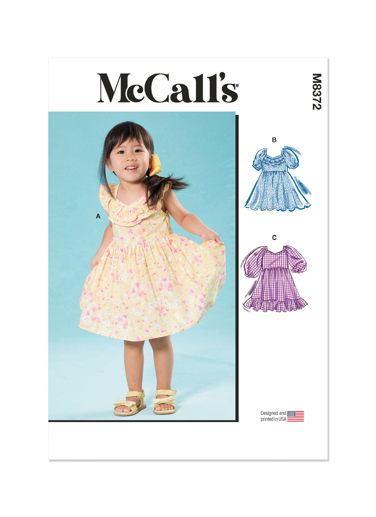 McCall's M8372 sewing pattern envelope showing knee-length toddler dresses
