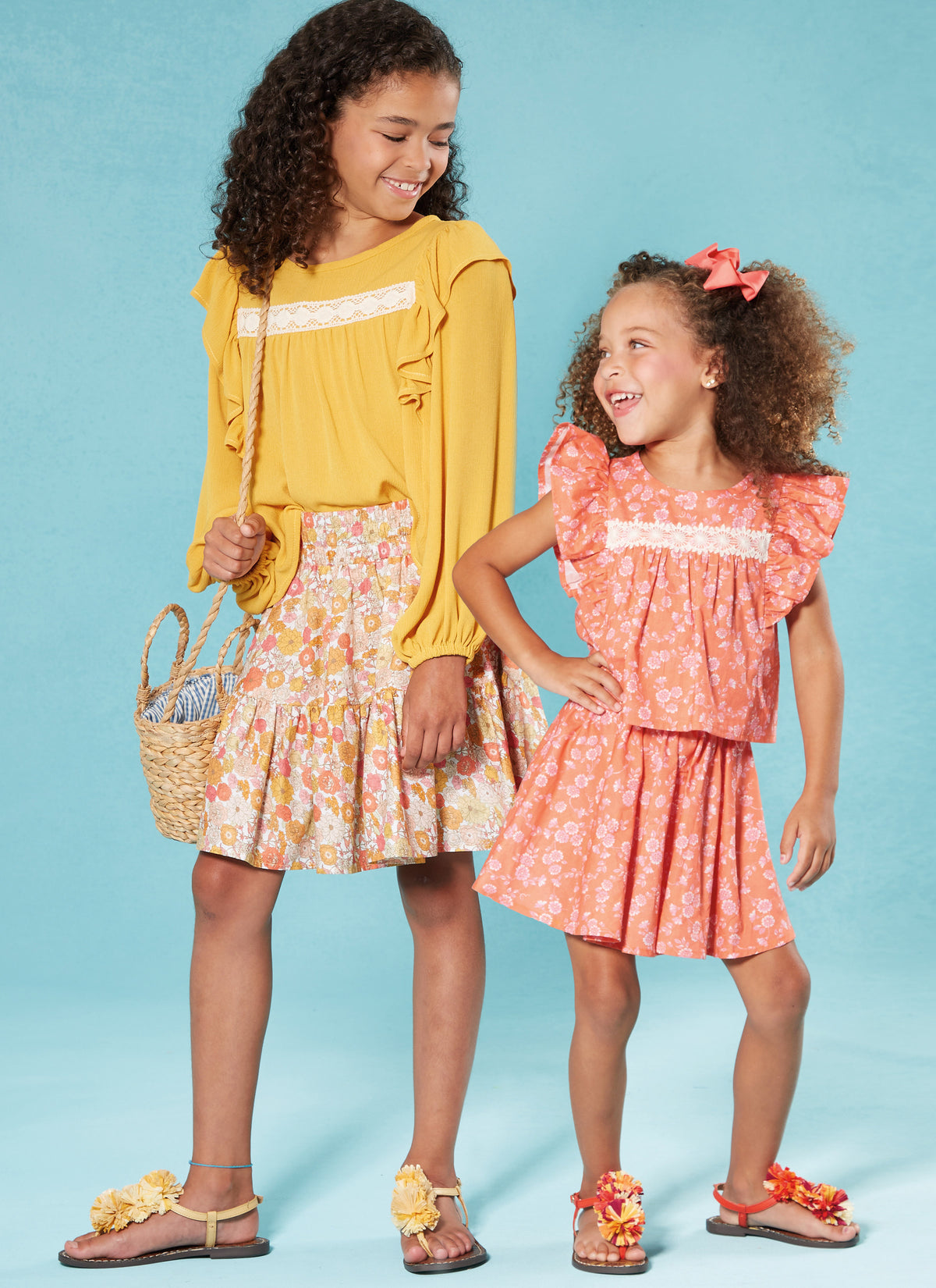 McCall's M8373 sewing pattern envelope showing a girls' top and skirt set