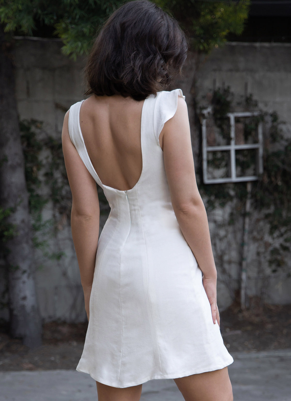 McCall's M8382 sewing pattern envelope showing a close-fitting dress in short or long length