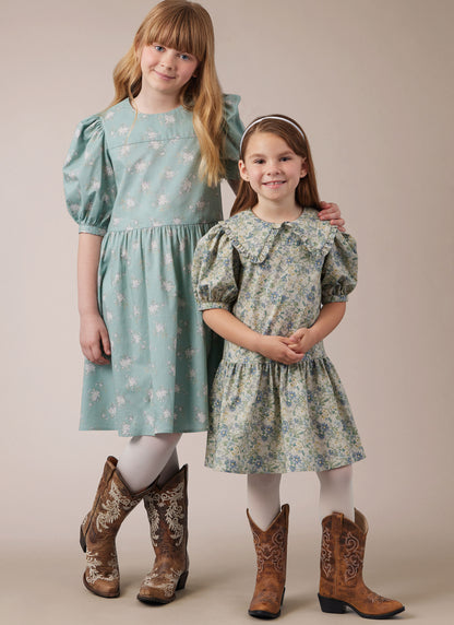 McCall's M8444 sewing pattern envelope showing girls' puff sleeve dress designs