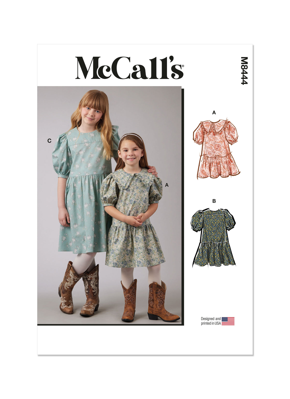 McCall's M8444 sewing pattern envelope showing girls' puff sleeve dress designs