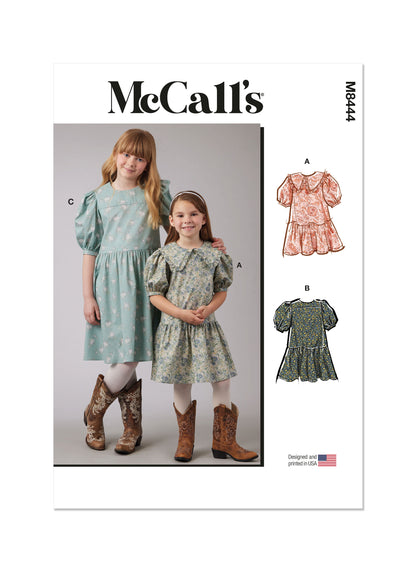 McCall's M8444 sewing pattern envelope showing girls' puff sleeve dress designs