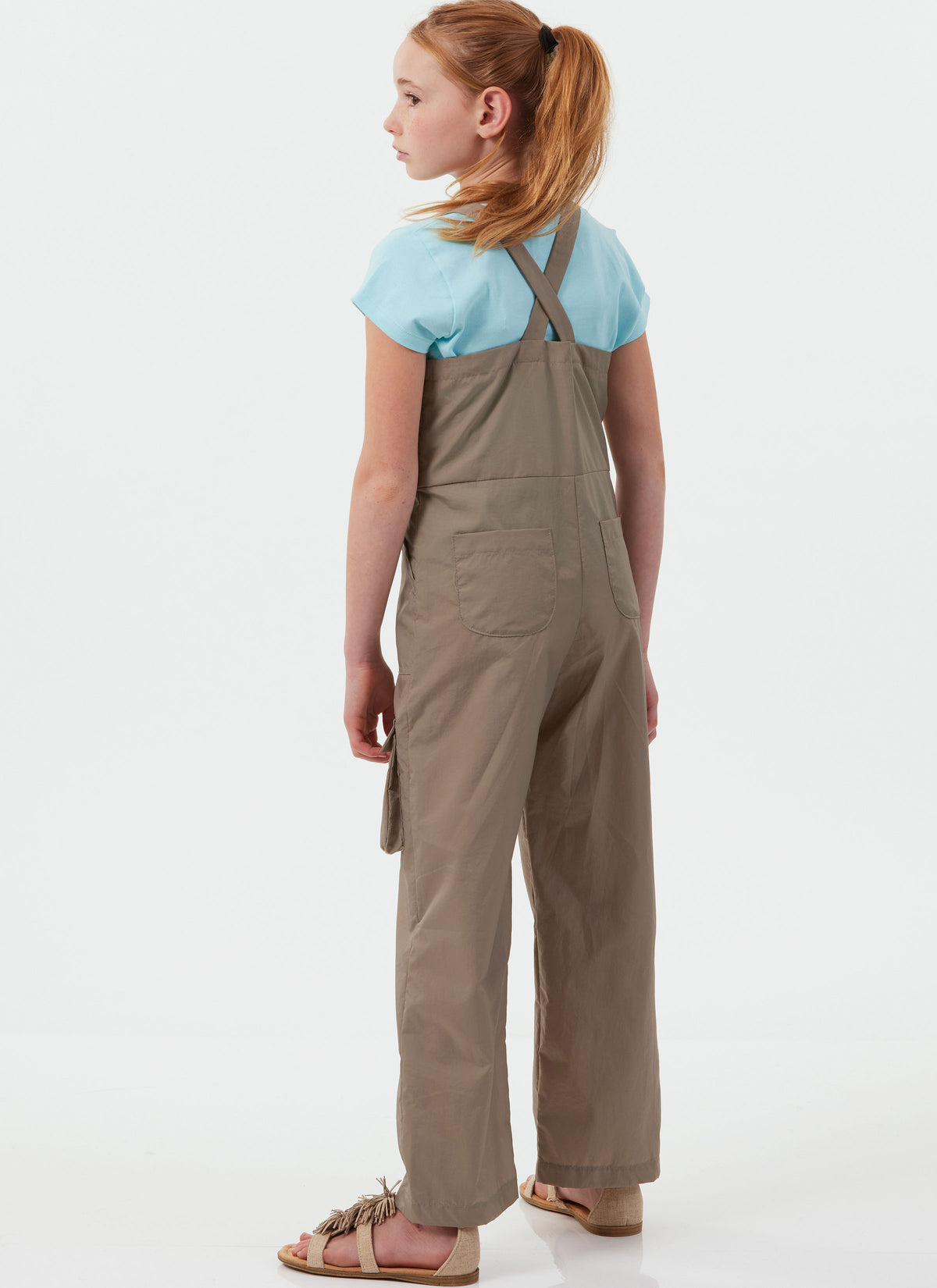 McCall's M8489 sewing pattern envelope showing girls' pinafore & overalls designs