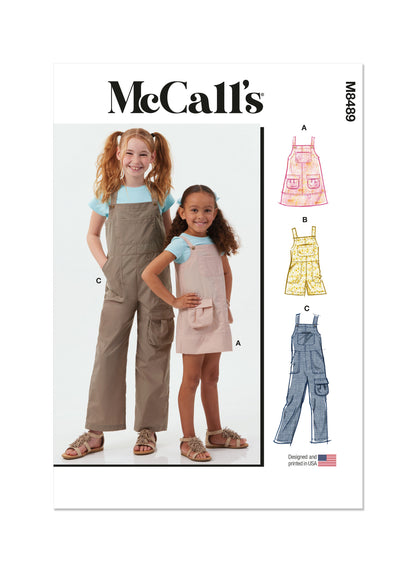 McCall's M8489 sewing pattern envelope showing girls' pinafore & overalls designs