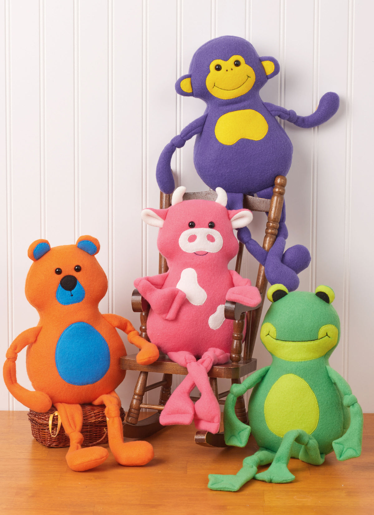 McCall's M8546 pattern envelope showing a stuffed bear, frog, monkey and cow