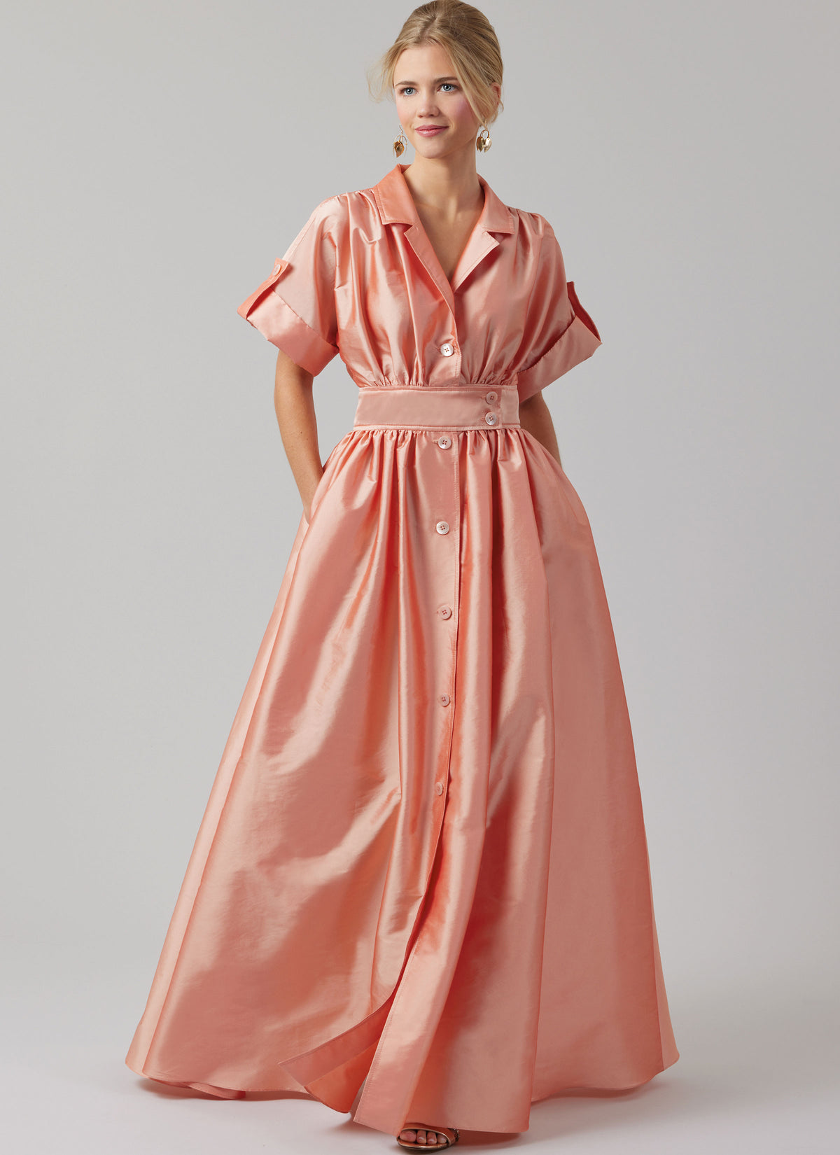 McCall's M8556 pattern envelope showing a button front dress with full skirt